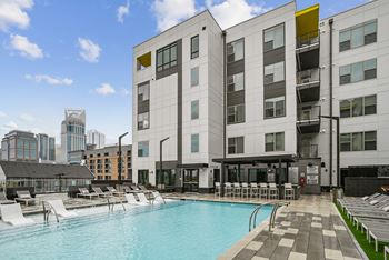 A swimming pool in front of a building